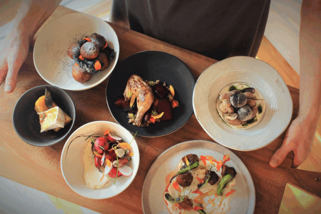 An aerial view of dishes at Emmer & Rye, a top F1 restaurant in Austin.
