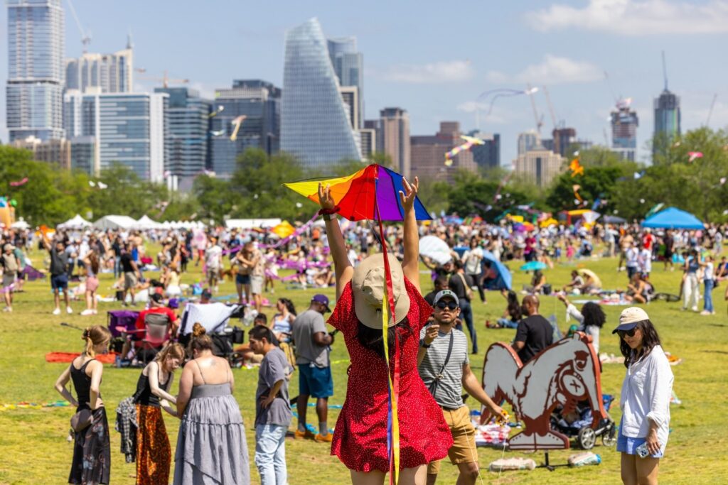 People flying kites at Zilker Park during ABC Kite Festival in April.
