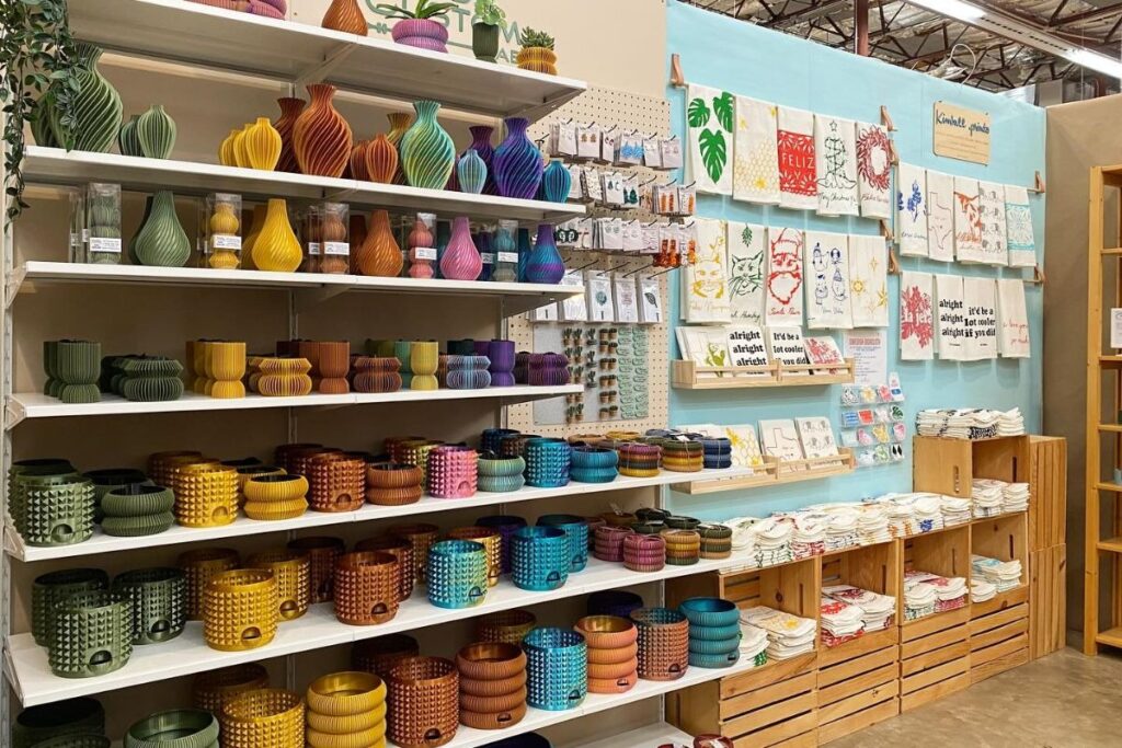 Maker displays at Blue Genie Art Bazaar, an Austin holiday market.